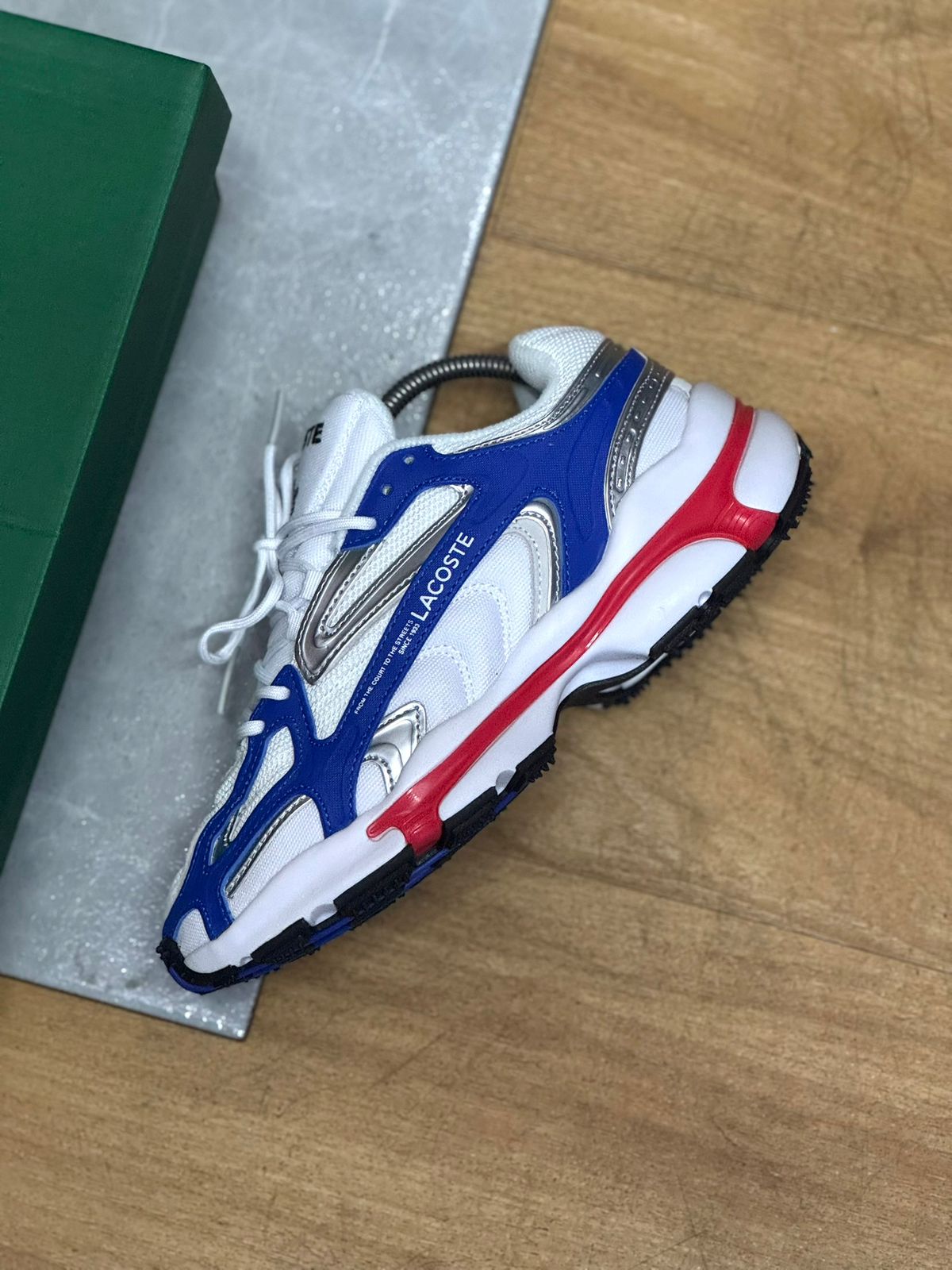 LACOSTE L003 2K24 BLUE WITH RED